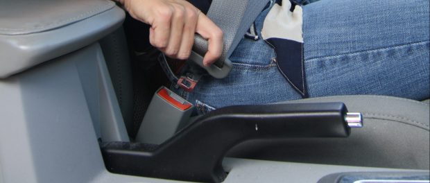 Car passenger wearing seatbelt
